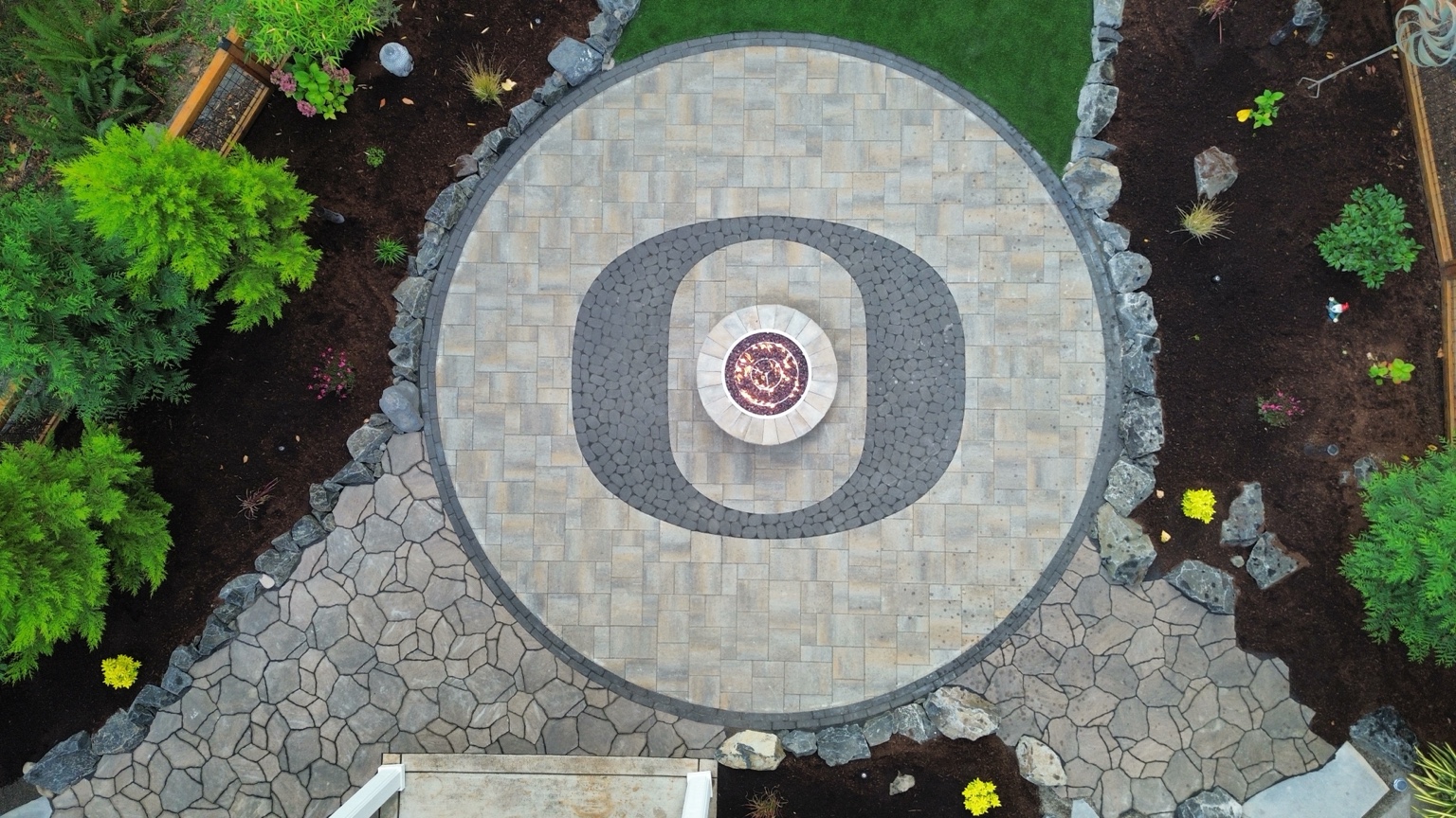 Aerial view of custom Oregon O paver patio and fire pit
